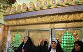 Iran - Qom - ladies visiting a mausoleum and having their photo taken in front of the zarih