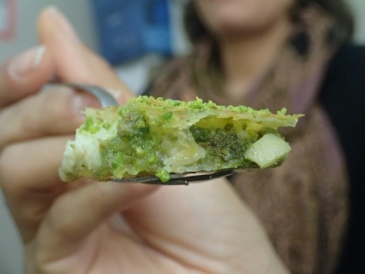 A slice of the baklava with clotted cream