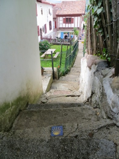 Camino symbol on walkway to Albergue