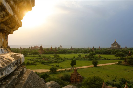A storm rolls in during sunset over the Buddhist temples and pagodas of Bagan.