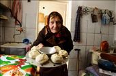 My grandmother lives in Kyrgyzstan, Central Asia. Life here reverts back to the Soviet era. In this photo my grandmother is offering steamed dumplings on my last day there, she was emotional, nervous, sad and yet eager to please. Everything is made by hand, and there is no such thing as an electric mixer in my grandmothers’ world. In fact almost all the equipment she owns dates back 15 or 30 years. This is a place where wires hang exposed from walls, washing machines are like gods - and are even given rest breaks ( meaning we revert to hand washing) to ensure that the washing machine doesn’t over work. My grandmother somehow turns into a comedian when I bring western travelers to their place to stay, she becomes the charismatic centre of attention as she sits in her kitchen happily questioning and joking with a room full of young travelers.: by pjan3202, Views[997]