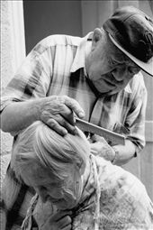 My grandparents just have each other, and rely only on each other in all daily tasks. This typical hairdressing scenario is a tender yet utilitarian moment between the two. My grandfather is by no means a hairdresser and the resulting hairstyle is usually haphazard and ragged. This shot was taken as my grandmother was giggling and telling him not to clip her neck or ear again. : by pjan3202, Views[391]