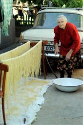 My grandmother prepares everything in bulk, in this image the winter supply of handmade noodles is in progress. She spends a day and 44 eggs to make enough of a pasta stockpile to last all winter. She has a true squirrel nature, and the basement is stocked with enough preserves, pickled watermelon, compotes and other produce to last at least 6 years. When she kills a chicken, she automatically places it at the back of the freezer for later, and instead chooses an elderly specimen, which has been in frozen for a long time. On one of my first visits, I discovered a chicken that had been in the freezer for 5 years.: by pjan3202, Views[739]