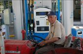Farmer filling tractor at service station: by pjandc, Views[235]
