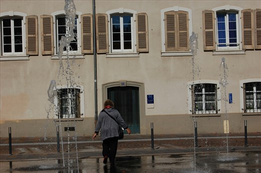 Celeste playing in water fountains in Mulhouse