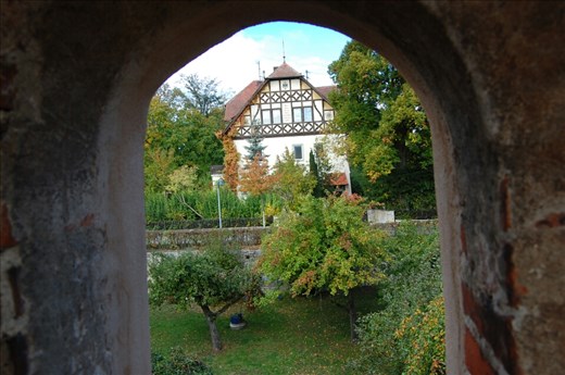Looking out a peep hole in the wall