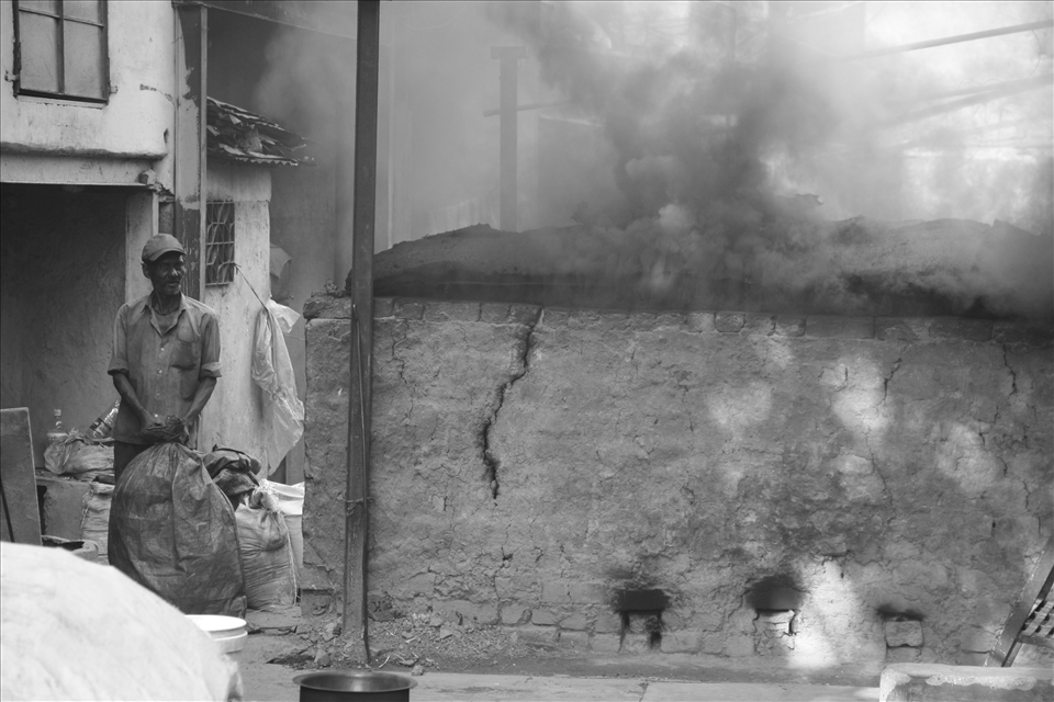 Another day in midst of black smoke. It doesn’t matter whether the sky is clear blue or black, for the worker entrusted with the kiln the only thing that matters is that the kiln is rightly fired. Earning less than a dollar per day, the importance of two square meals makes him enjoy the day’s work even though the smoke will make him susceptible to illness like asthma, bronchitis etc..