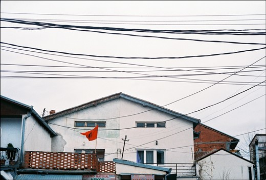 Prishtina appeared to be a city where when you look up - you see the web of wires, numerous minarets that pierce through it to reach the sky and red spots of the flag with a black eagle – unofficial separatist flag used from 1991 to 2000 and yet still extremely popular among Albanians in Kosovo as a symbol of the victory. 