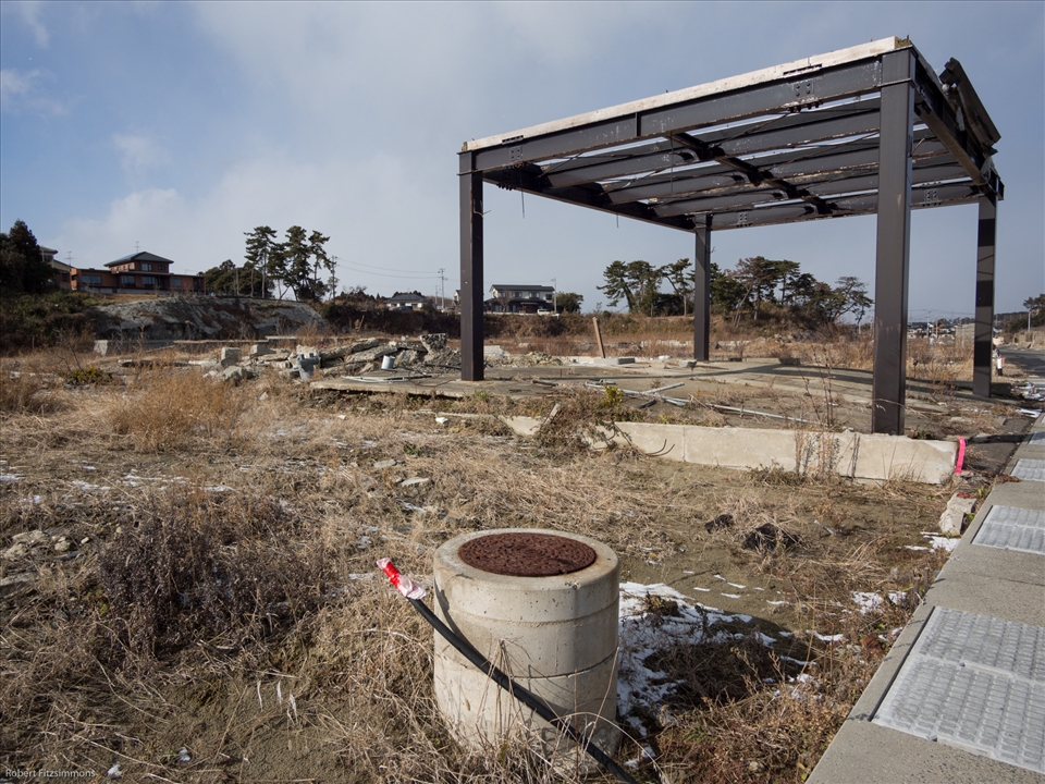 The drain shows how much was taken away by the tsunami as it is at ground level