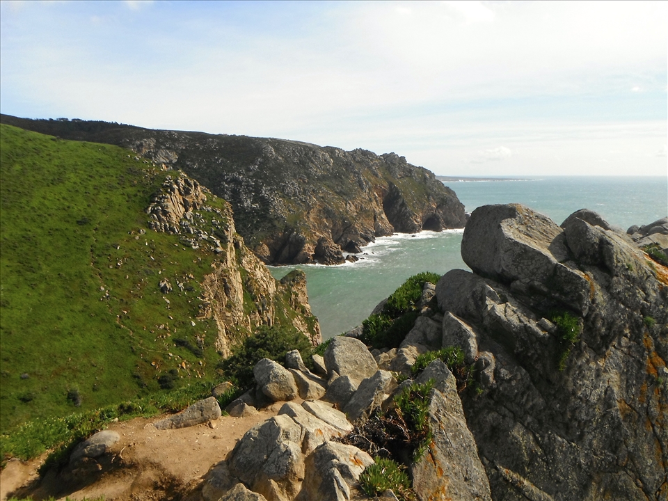 Bracing against the fierce wind of the Cabo da Roca, experience the edge of the world.