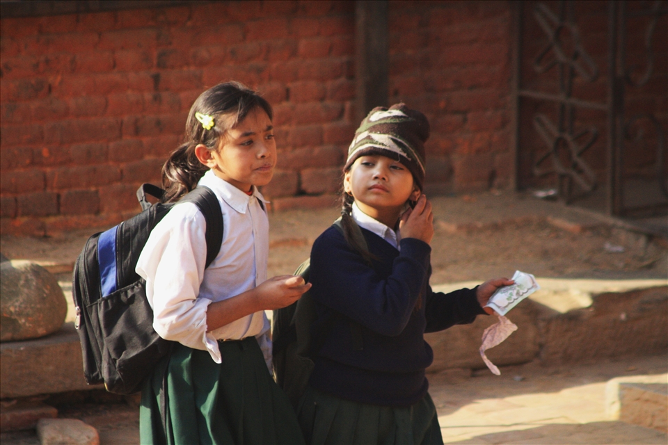 School girls make their way home after another day of learning