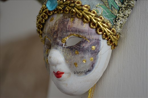 the hung mask. it is all decorated and glittery. waiting for its master