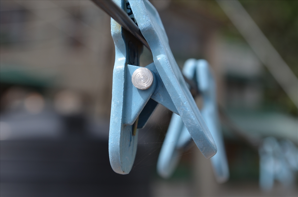 queue of clips lying outside in the winter sun.