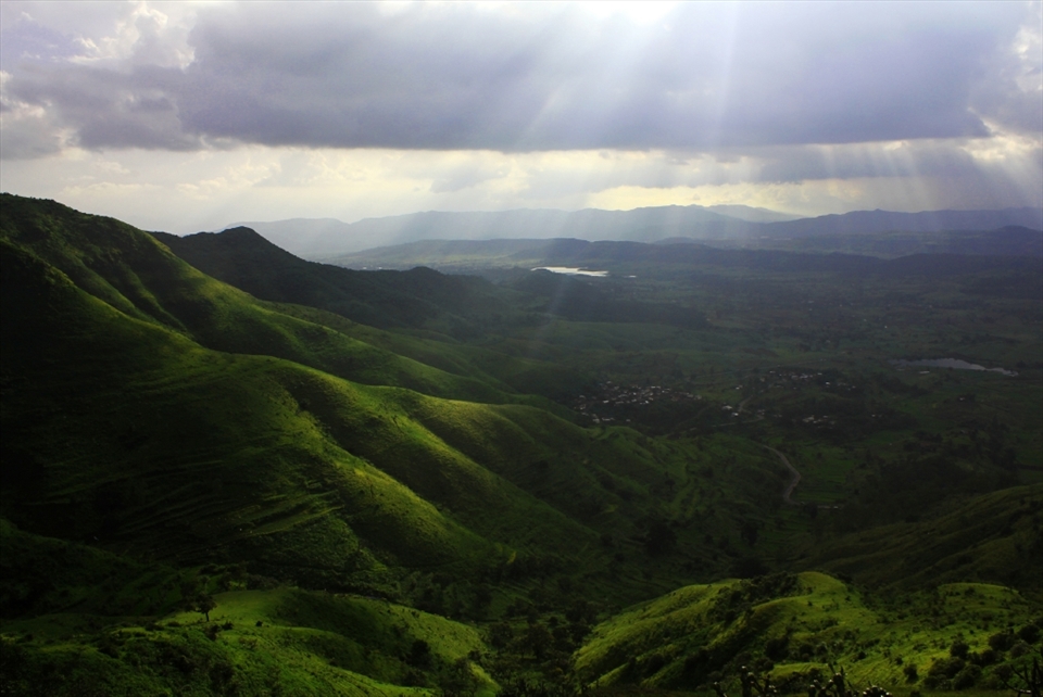 There is A mountain area The Ray's of sun is sprding on mountain like true haven