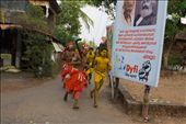 God and Communism: Kannur, Kerala, India: Theyyam performers returning after cock-sacrifice. The juxtaposition of traditional Hindu ritual and the communist banner in the background reflects the current political scenario in Kannur, Kerala. Even to the present day Kannur district is a strong hold of communist party in Kerala.: by praveendev, Views[2353]