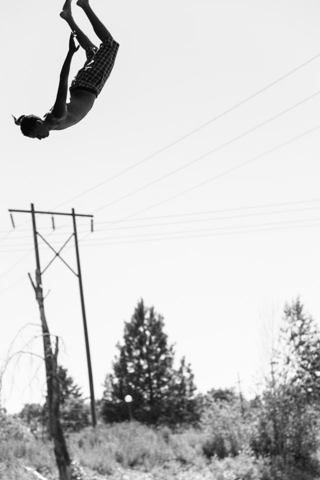 (3) Missoula is intertwined with several beautiful rivers.  Though famous for its fly fishing, the Clark Fork River that bisects the town draws a constant flow of thrill-seeking bridge jumpers.  This particular jumper looks strikingly serene in spite of the exhilaration that the experience delivers.  He and his friends were visiting students in town for a swimming competition, but it didn’t take them long to blend right in with native “Missoulians” at the river.