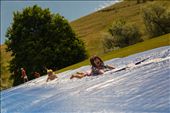 (2) Even though there are over 60,000 residents, Missoula retains a “small-town” feel. The pace of life can be as fast or as slow as one chooses it to be.  Neighborhood children shown above slip-and-slide down a hill during a community barbeque open to all.  Here, there is no right or wrong way to enjoy oneself.: by prhutchi, Views[784]