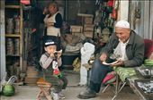 A peek into the life of a typical Uyghur family, in Xinjiang, Western China. It appears that bonding over a freshly sliced melon is an integral part of their culture. There is this great sense of intimacy that radiates from them, when you see them relishing the sweetness, in both the fruit as well as the kinship.: by priscilla_ong, Views[1153]