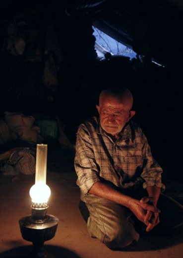 Grandfather, as he is known, takes a moment after a long hard day. A rare picture of hime without a smile. He is almost always ready with a joke or a laugh. Curious as a cat, he wanted to know why two women were traveling alone and if I was married. I managed to convey to him that I wasn't. With a twinkle in his eyes and mischief in his smile, he asked back, 