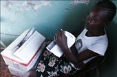A concerned mother sits in front of Plumpy'Nut, a life-saving medical food: by proimos, Views[329]