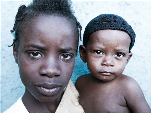 Mother and son pose before the regular check-up at the Shada Clinic