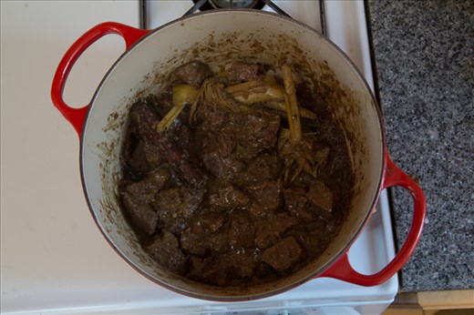 After cooking for two and a half hours, Beef Rendang gains a rich, brown color.
