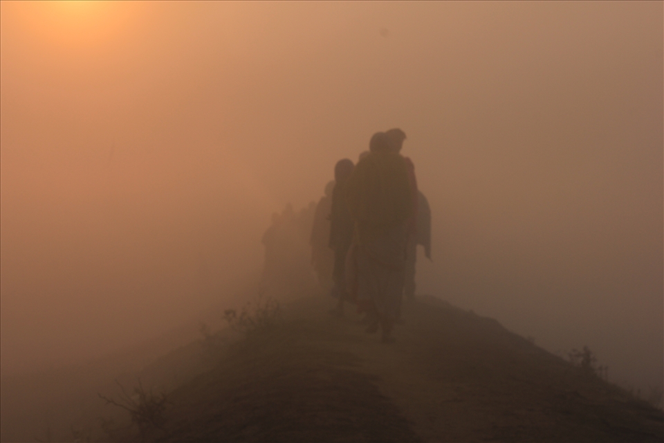 Villagers returning to their home in the morning to get back in their daily life