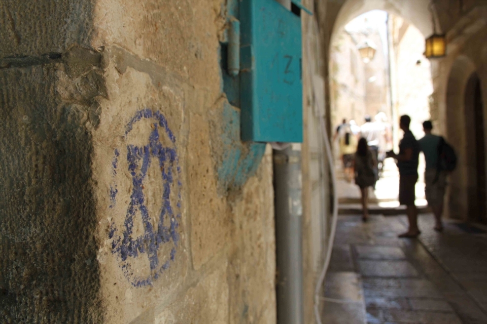 There is a sense of history and importance on every corner in the Old  City of Jerusalem. There are religious symbols and paraphernalia in front of you at every, each side staking a claim. This picture is of a star of David drawn with chalk on a wall in an alley in the Old City. I focused on the star and left the people in the background as blurred silhouettes, to symbolise how in this country, and this city in particular, religion is considered more important than people.