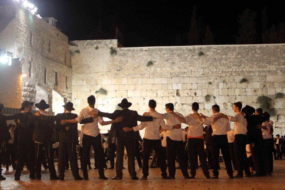 The Jewish people are very proud of their religion and it has resulted in a very close and sometimes self centered community. In this picture I captured men celebrating at the wailing wall, I tried to capture their attention focussed on the religious site and their backs turned to me the outsider.