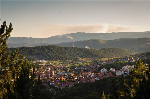 The last remaining industrial town in Montenegro, Pljevlja, as seen from one of the surrounding hills. Behind another hill, the flue-gas stack of the thermal coal plant can be seen. The hill is but a minor nuisance as far as the gas is concerned. Montenegro relies on Pljevlja as the country's main economic engine, but in an industry which demands exploitation of the town and robs the residents their well-being and the ability to decide their own future. Pljevlja has intense potential for a promising future with its geographic position and exceptional natural resources, but will that future will be smothered by the fumes of a country which relies on its toxic exploitation? 