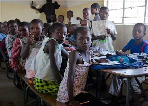 This photo was taken in a school for orphans. Zambia's Western Province has the highest percentage of orphans in the country. There are two classrooms, two teachers and they teach nearly 400 pupils each day.