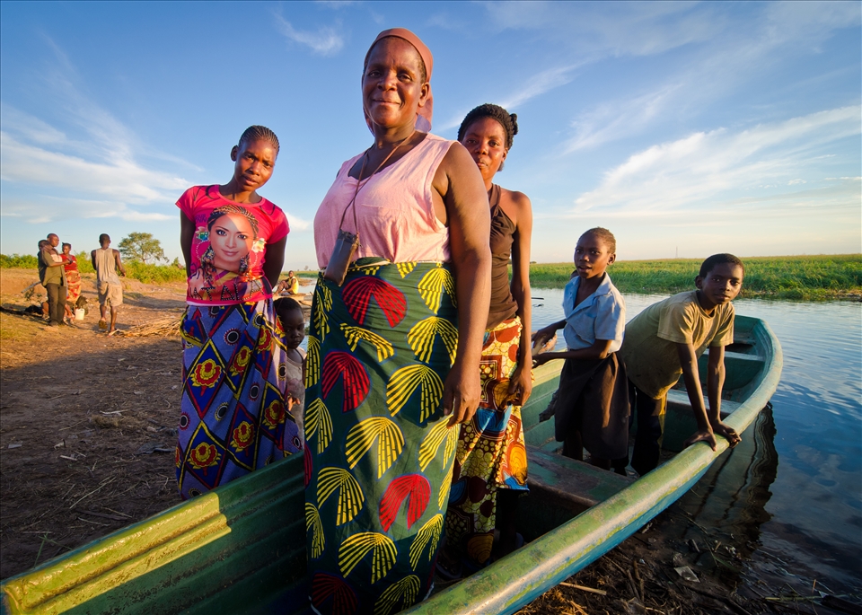 The market at the edge of the Zambezi is where most people from the surrounding villages spend their day. This woman and her family row 10km up the floodplain everyday during the high season to sell rice and sugarcane to those living in the town.