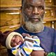 This man was in his final year of studying medicine before he had to leave his home in Angola because of the civil war. Despite having finished the training and exams he was never officially qualified. He and his wife now run a village for orphans. The baby girl in the photo and her twin sister were only 4 days old when this was taken. Their father died of AIDS and their mother died during childbirth. by: ptrmcky Views[349]