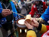 'Sake' rice wine is doled out to eager onlookers with traditional wooden implements and cups. Reverence of natural materials mirrors the respect for the natural forces that grow crops.: by puritto, Views[593]