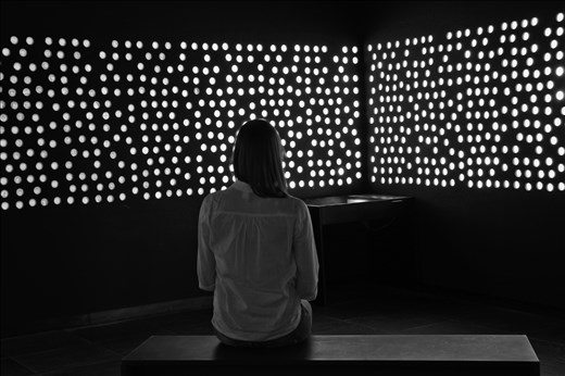 Illuminated circles represent the identified  victims of the massacre and there you can see photos, names and messages of victims before the massacre. The dark circles represent the unidentified victims. 