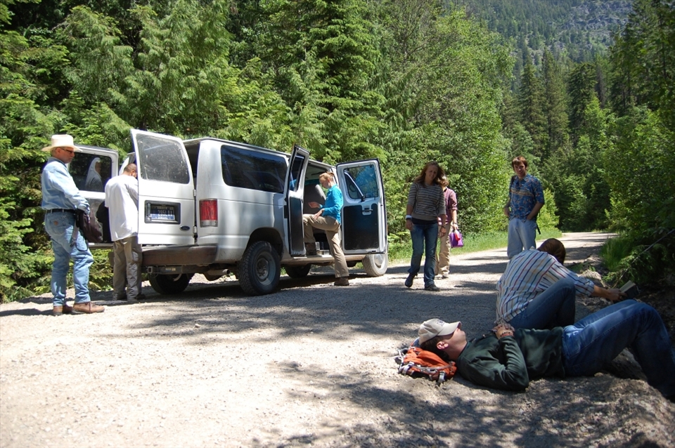 Students enjoy a lunch break after marking several forest plots up in a montane forest