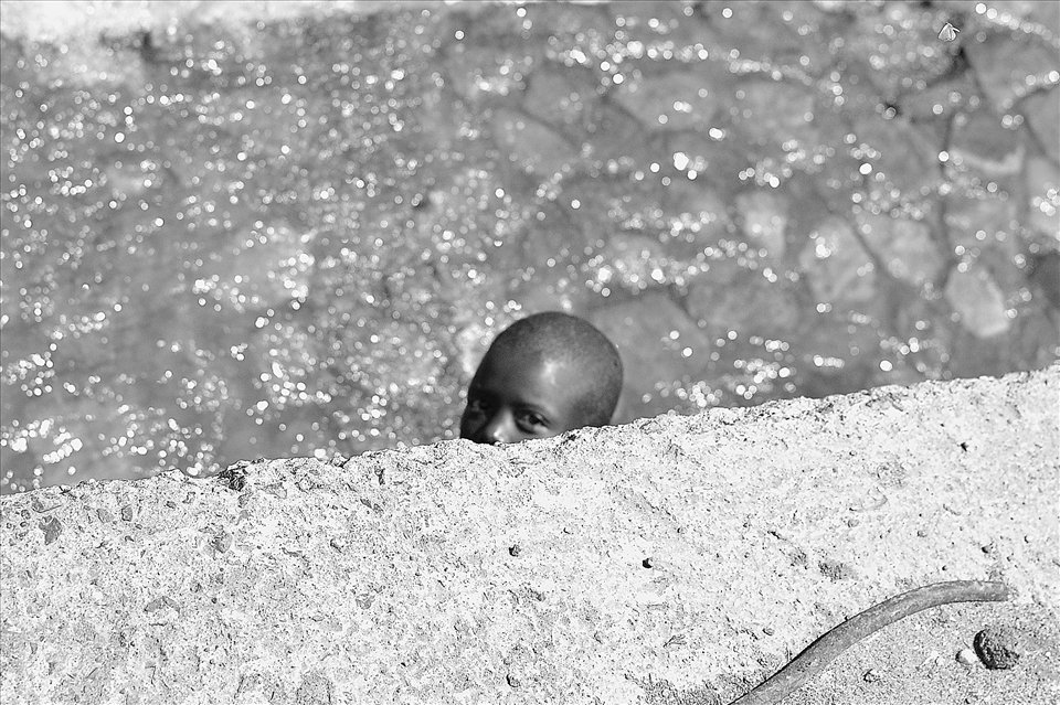 Boy peering out from under a bridge had to act fast to capture this moment