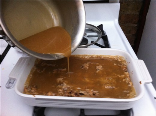 Pouring half the toffee onto cake