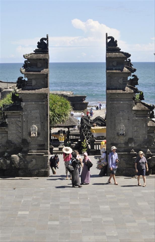 Temples are tourist attractions in themselves in Bali. Many tourists come to the famous Tanah Lot to see the temple on an island in the sea. The Balinese use the temples for worship, but they have become a tourist attraction, and therefore a way to make money. 