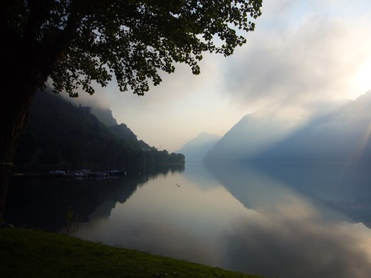 The morning view from the plot at Camping Pilu by Lake Idro