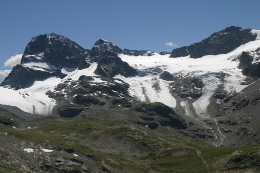 Piz Buin (far left) on a sunny day. The route goes from the valley, over the glacier and up the rocky flank