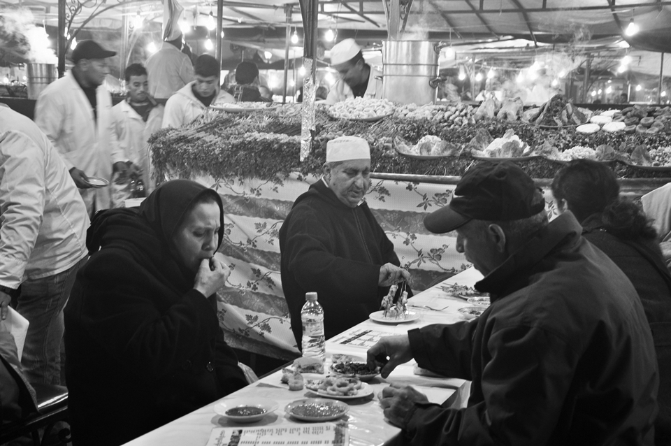 Dinner on Jamaa-El-Fna, Marrakech, Morocco, December 2012 - Jamaa-el-Fna is a square and market in Marrakech´s medina quarter (old city), where you can satiate all your senses, especially when you are hungry, this place is perfect for you. The lot of flavor and smells – of delicious Berber cuisine as is a tasty Tajine or the famous and tasty Arabic Couscous and many others – which not only enjoying by local people but certainly also by the turists from around the world.