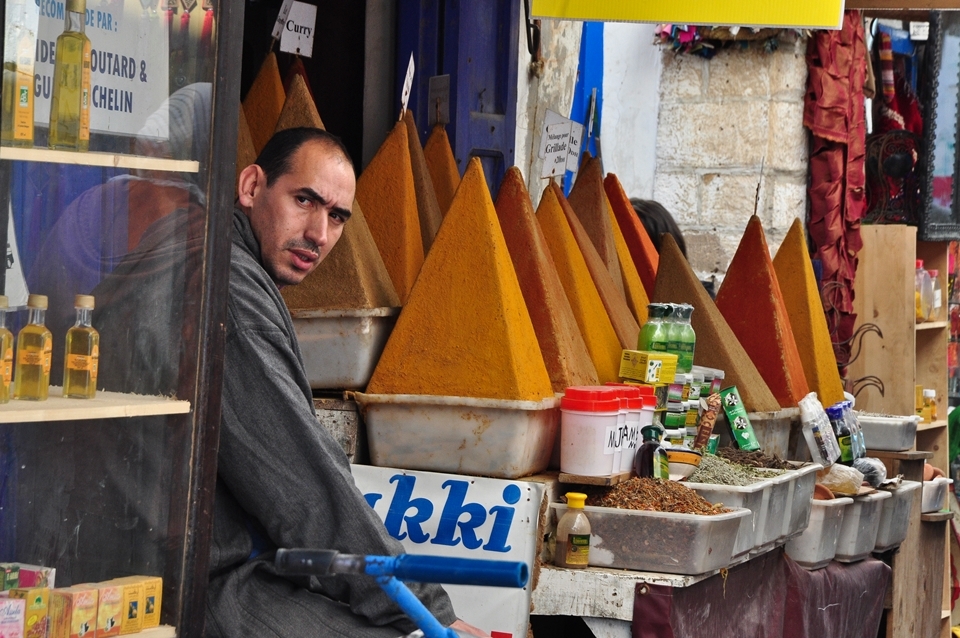 A seller of spices. Essaouira, Morocco, December 2012 -

I often had a feeling, that Marocco is place where people are selling and buying during a day and who are eating and singing during a night. Lot of markets with many interesting products as the colored spices, the leather or silver products, the mirrors and lamps, the ceramics, the paintings, the olives and fruits and much more it is a place for everyone who love shopping with really oriental atmosphere.