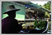 A vendor selling fruits on a floating market in Damnoen Saduak, Thailand : by rafa-kimi, Views[347]