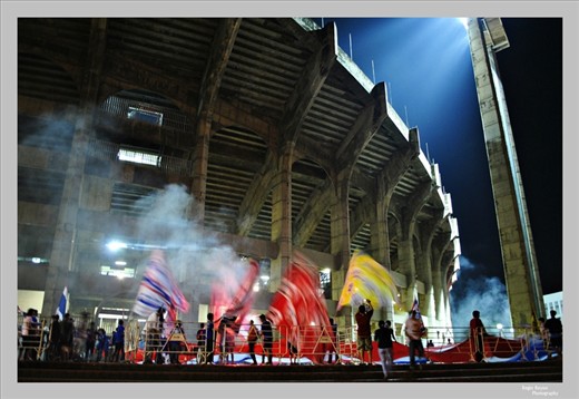 Thai football fans cheer for their team outside Rajamangala Stadium in Bangkok,.