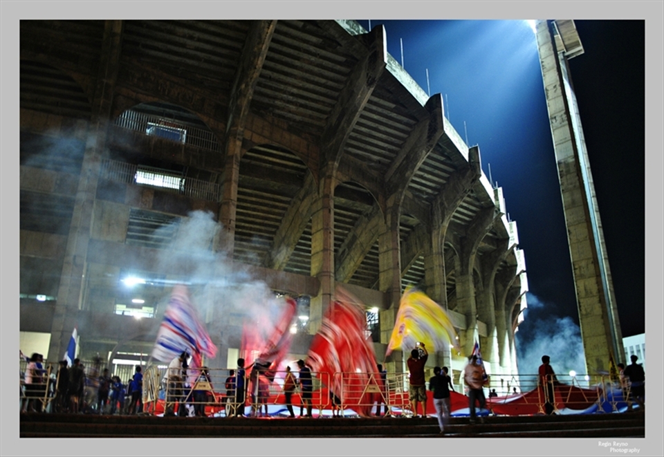 Thai football fans cheer for their team outside Rajamangala Stadium in Bangkok,.