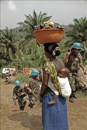 Mum, baby, blue halmets and dirthy clothes. A rutinary day in the village.: by rafelas, Views[246]