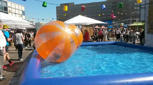 Kids playing in big blow up balls at Alexander Square