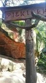 On Sunday morning Krysztof and his family took us on a small hike where there were multiple giant rock formations. Labeling each rock there was a carved face in wood.: by rafellarayne, Views[275]