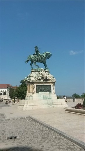On the palace grounds, anothean on a horse statue. 